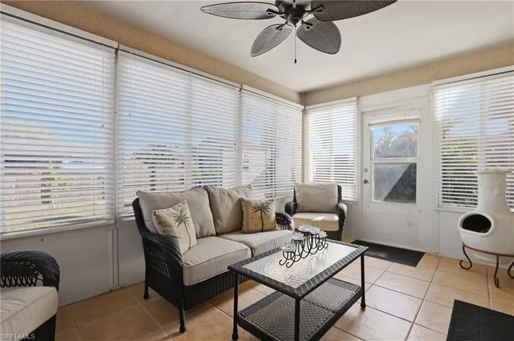 Sunroom / solarium with tile patterned floors