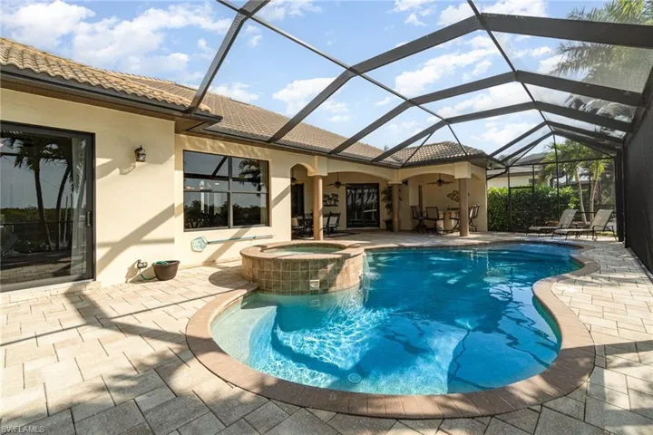 View of pool featuring an in ground hot tub, a patio area