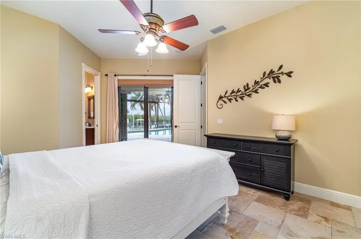 Bedroom featuring ceiling fan and access to outside