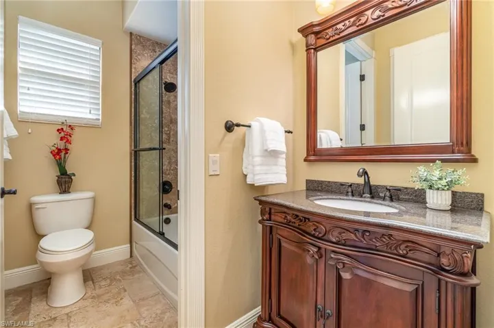 Full bathroom featuring vanity, shower / bath combination
