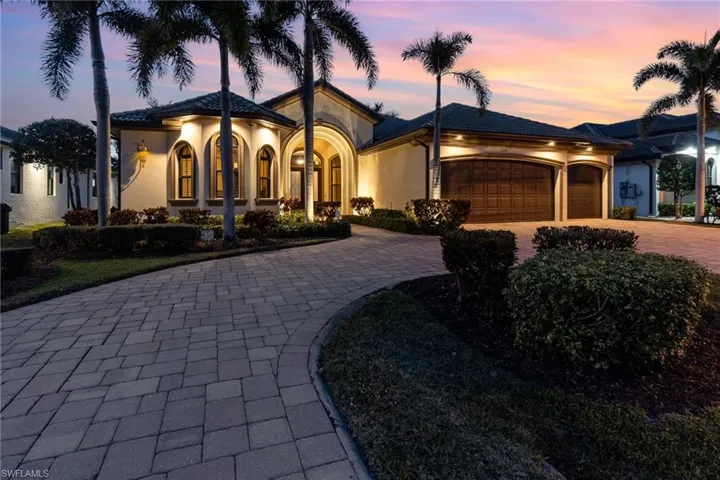 View of front of property featuring a garage