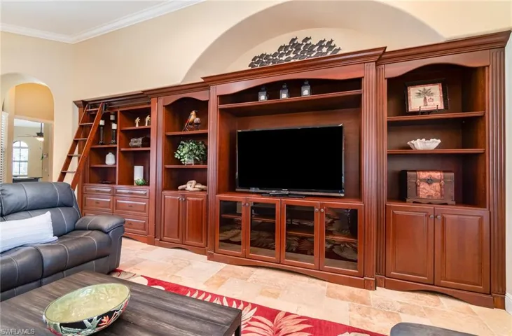 Living room featuring huge entertainment center