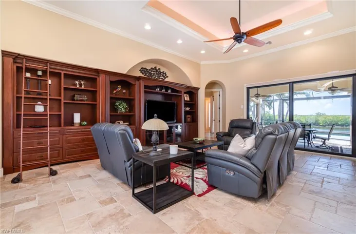 Living room featuring a tray ceiling