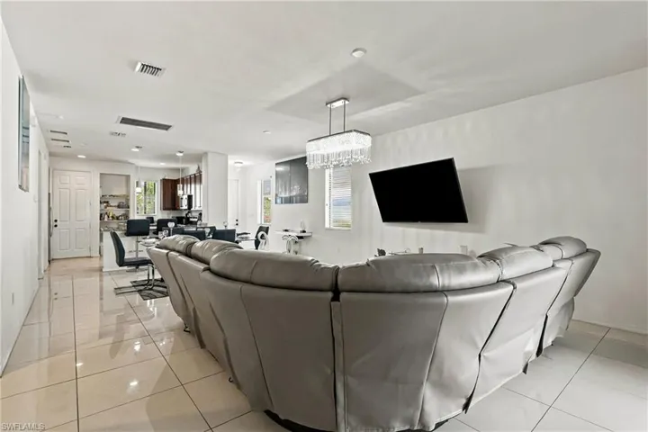 Open-concept interior featuring tiled flooring and recessed lighting
