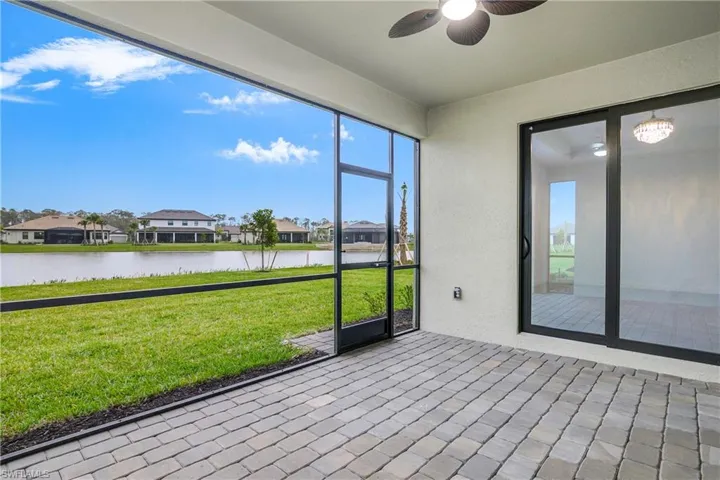Enjoy indoor/outdoor living with large screened-in lanai. Note the privacy Clusia on the perimeter of the property.