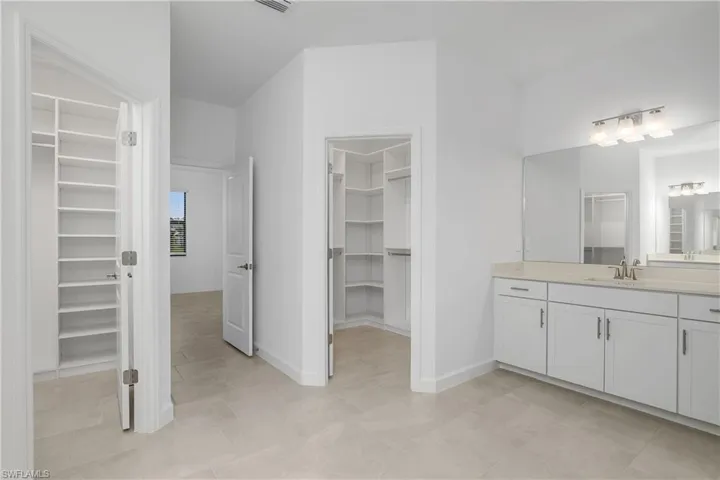His/Her Closets with custom built-ins.