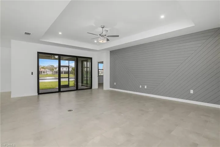 Enjoy seamless indoor/outdoor living with open great room featuring impact sliders, and large lanai.