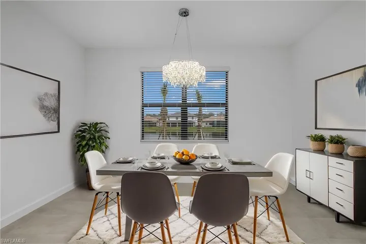 Family dining space is located just off the kitchen and features designer lighting and plenty of natural light. (furniture digitally added)