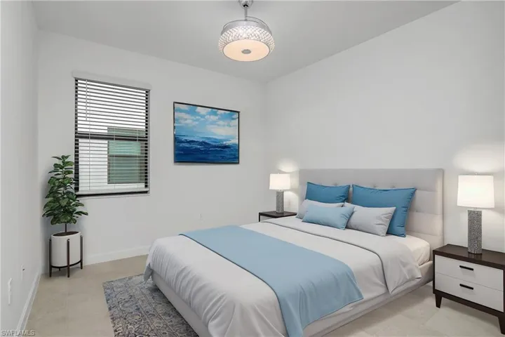 Spacious guest bedroom with ensuite bath includes chandelier/ceiling fan and plenty of natural light. (furniture digitally added)
