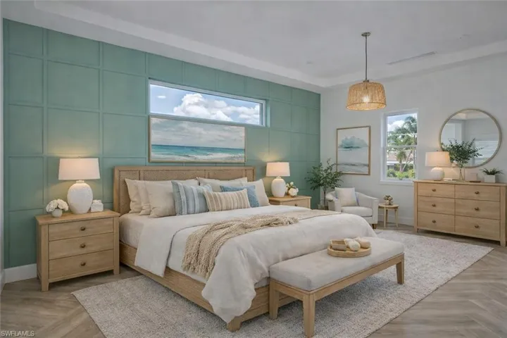 Bedroom with parquet flooring and a decorative wall