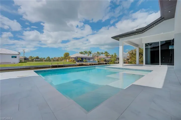 Swimming pool with a patio