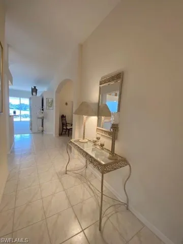 Hall with light tile patterned floors