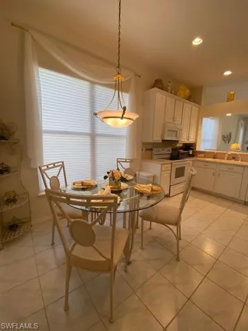 Kitchen Dining space featuring light tile patterned floors