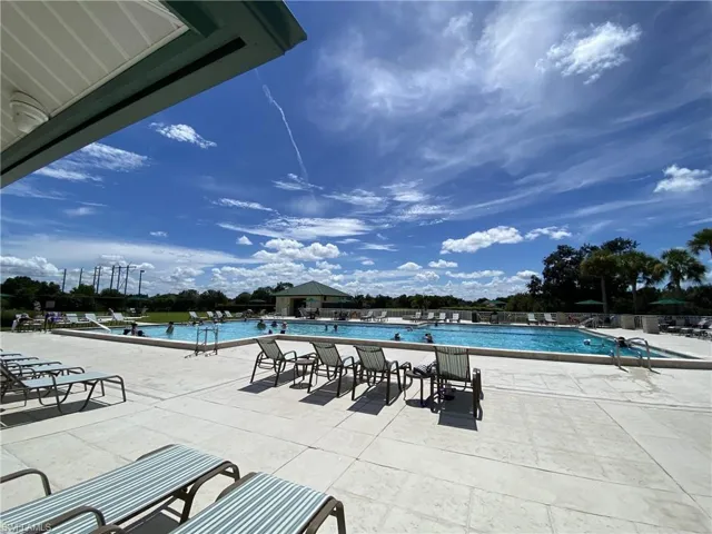 Gateway Community pool with a patio and a water view