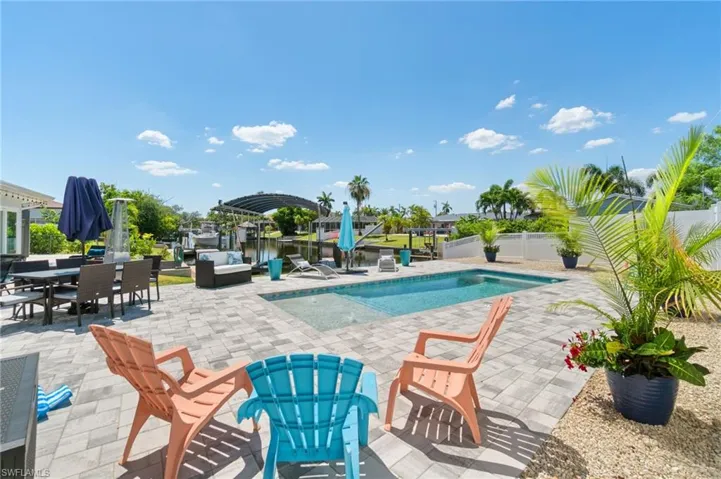 View of pool with a patio and a jacuzzi