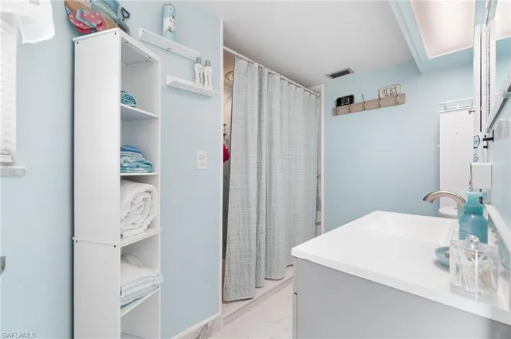 Bathroom featuring tile flooring and oversized vanity