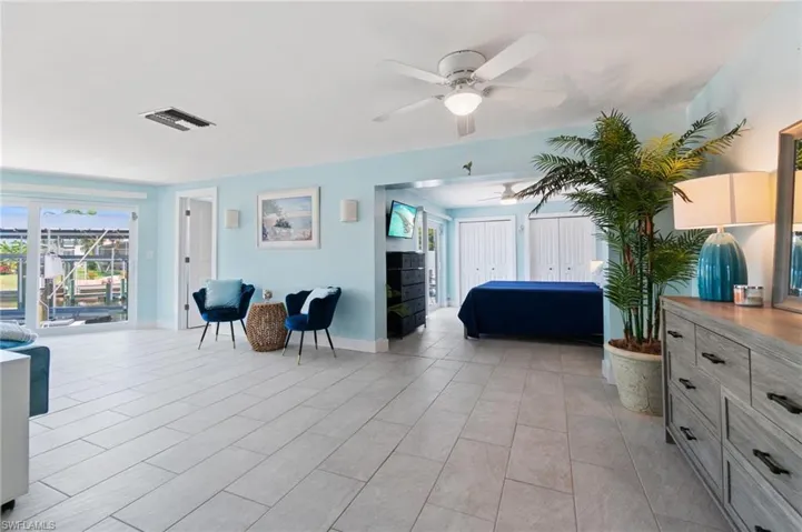 Tiled bedroom with ceiling fan