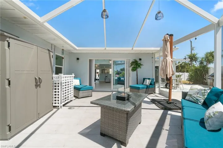 View of terrace with outdoor lounge area and a grill