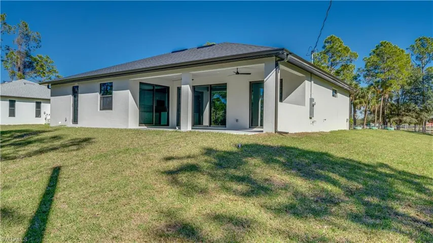 Large backyard with view of open Lanai.