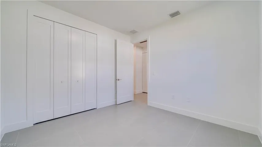 3rd Bedroom showing large closet & entrance from hallway.