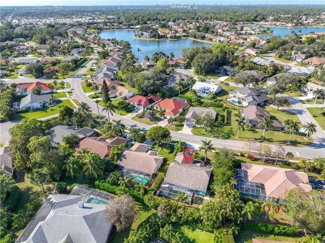 Birds eye view of property featuring a water view
