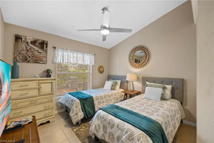 Tiled bedroom with ceiling fan
