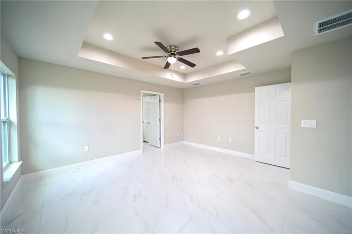 The Master Bedroom Has A Tray Ceiling With Custom Lighting/Ceiling Fan And A Huge Walk-In Closet!