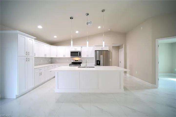 The Island Kitchen Comes With Quartz Countertops, Soft Touch White Wood Shaker Cabinets, Stainless Steel Appliances, Tile Backsplash, Floor To Ceiling Pantry, And Modern Lighting!