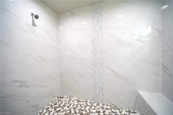 Custom Tile Glass Enclosed Shower With Seating Area IN The Master Bathroom!