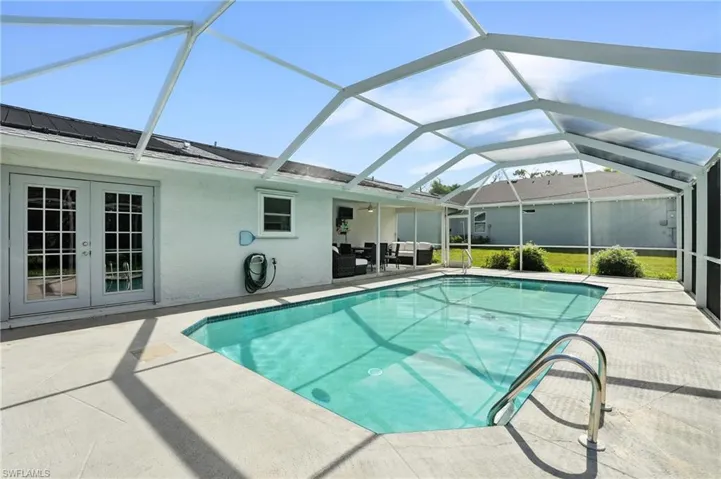View of green lawn with glass enclosure