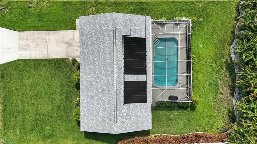 Aerial overview of property's location featuring nearby suburban area