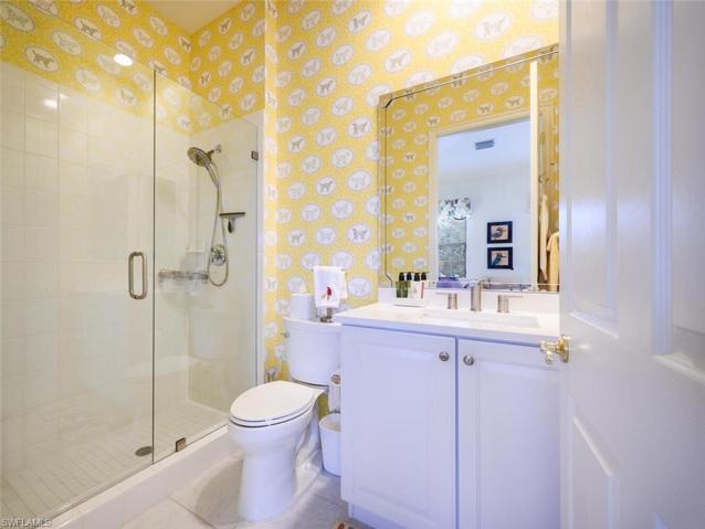 Guest Bathroom with Quartz Counter tops , New Shower Tile, and New Toilet
