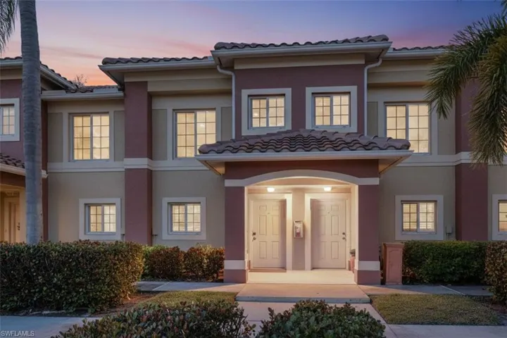 Mediterranean / spanish house with a tile roof and stucco siding
