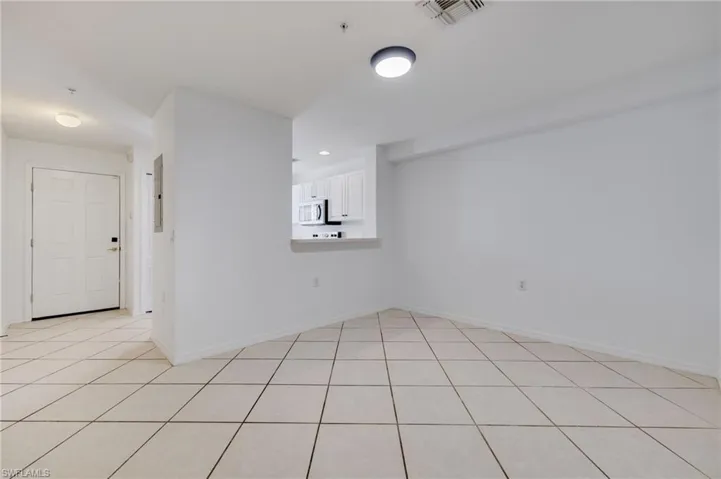 Spare room with light tile patterned flooring and recessed lighting