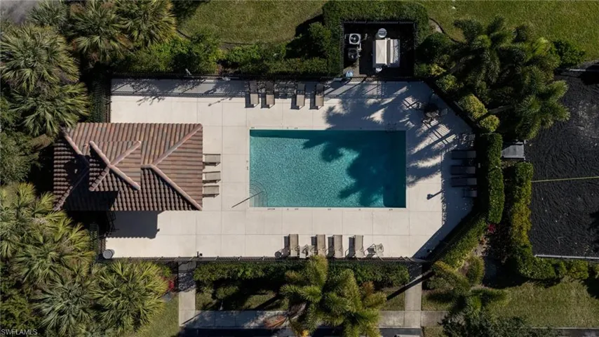 View of subject property featuring a pool area