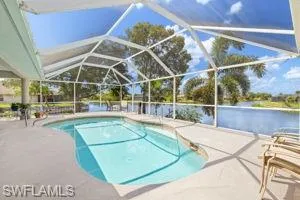 Pool featuring a lanai and a patio