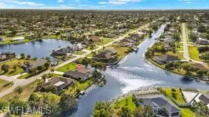 Aerial view with a residential view and a water view