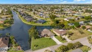 Birds eye view of property featuring a residential view and a water view