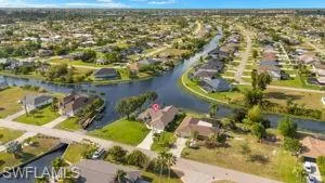 Drone / aerial view featuring a residential view and a water view