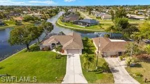 Drone / aerial view with a residential view and a water view