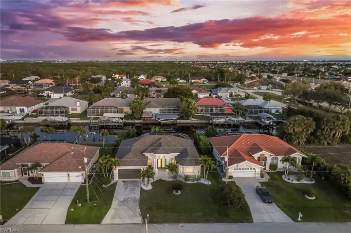 Aerial view at dusk of a residential view and a water view