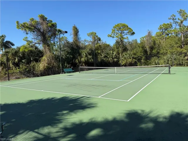 View of tennis court featuring community basketball court