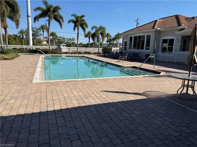 Community pool with a patio area