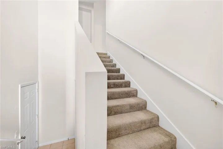 Stairway with a towering ceiling