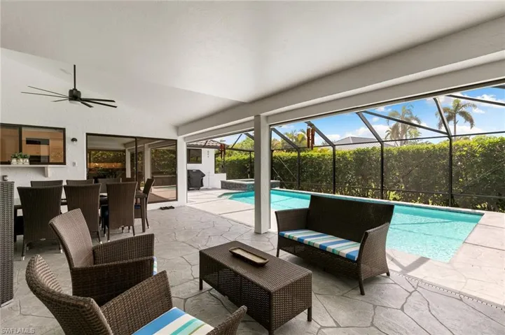 View of pool with ceiling fan
