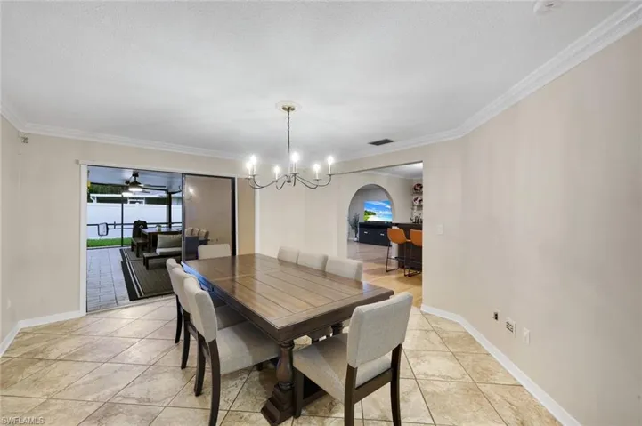 Dining area featuring neutral wall tones and tile flooring