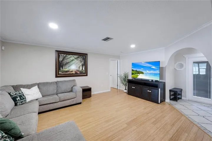 Light wood-finish flooring complements neutral wall tones