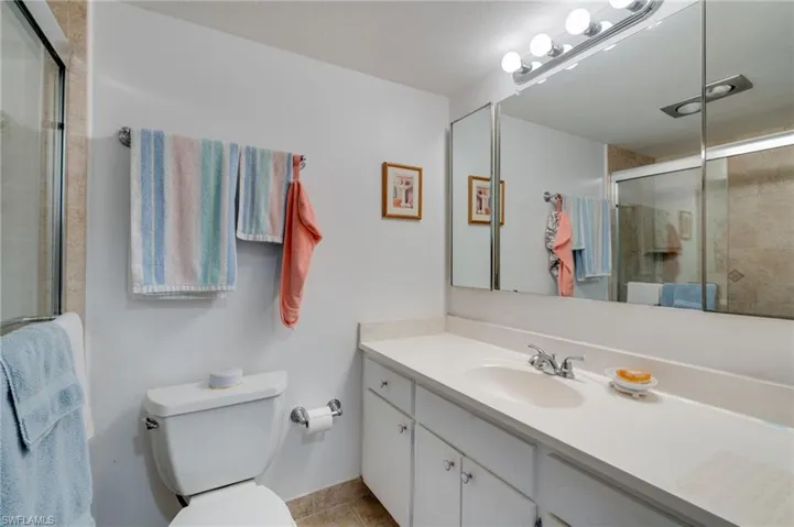 Primary Bathroom  light tile patterned flooring