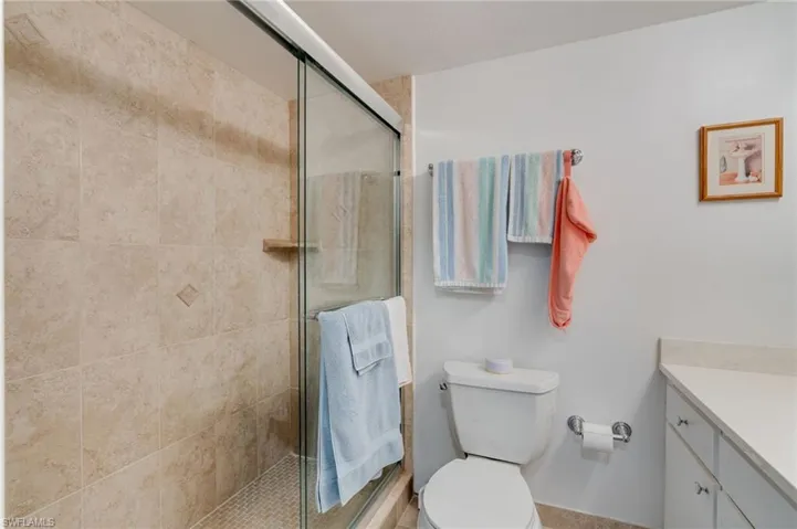 Primary Full bath with vanity and a shower stall