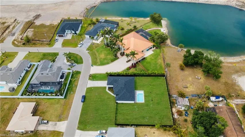 Aerial view featuring a residential view and a water view